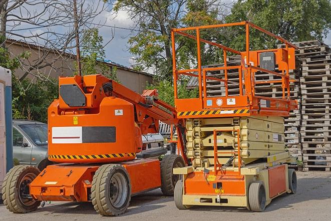 worker using forklift in industrial warehouse in Brookville